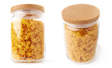 Set of glass jar filled with dry ditalini pasta over isolated white background