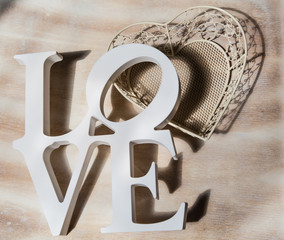 Wooden letters word LOVE on wooden background