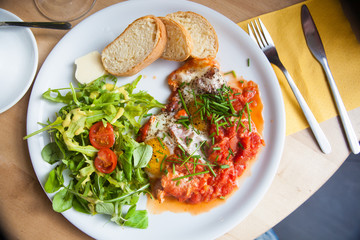 shakshuka fried eggs with sauce macro. horizontal background