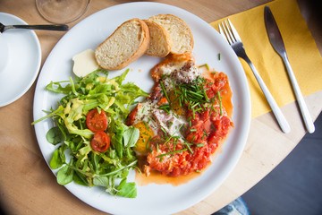 shakshuka fried eggs with sauce macro. horizontal background