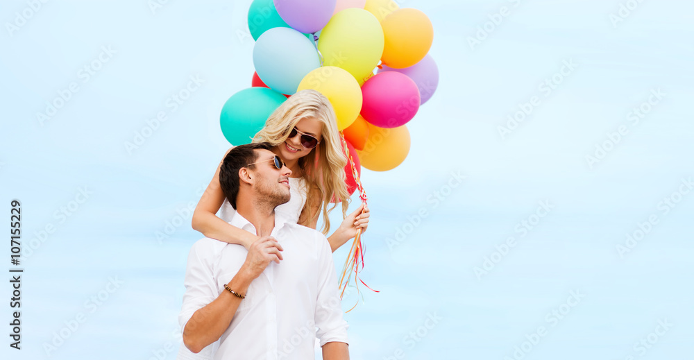 Poster couple with colorful balloons at seaside