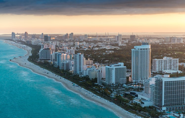 Naklejka premium Miami Beach at sunset, aerial view from helicopter