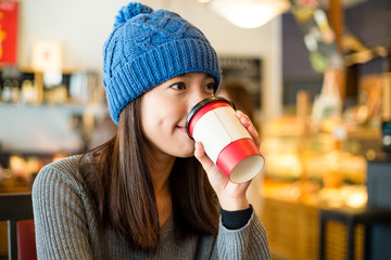 Woman drinking of coffee in cafe