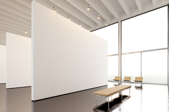 Photo exposition modern gallery,open space.Big white empty canvas hanging contemporary art museum.Interior loft style with concrete floor,light spots,generic design furniture and building.3d rendering