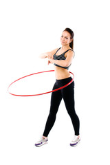 Fototapeta na wymiar Woman training with hula hoop isolated on white