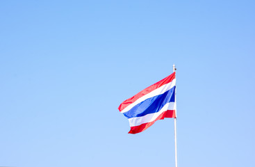 Waving Thai national flag with blue sky background