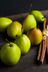 Fresh pears on a rustic wooden background