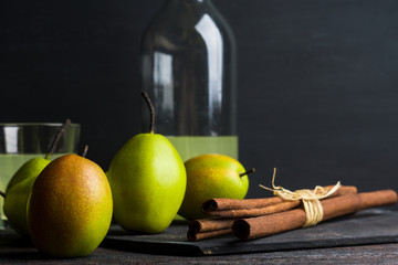 Fresh pears on a rustic wooden background