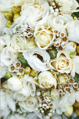 stylish, beautifully decorated wedding bouquet of lovely flowers