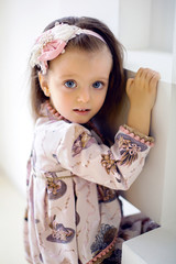 portrait of a little girl 2 years in a Studio