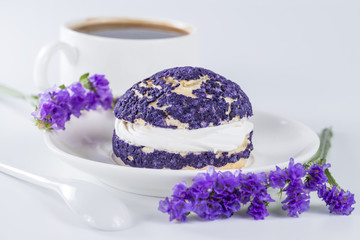 blueberry cake shu decorated with purple flowers of statice