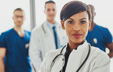 Female doctor in front of team