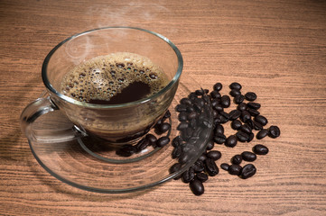 Hot Coffee and cup of coffee on wood texture background