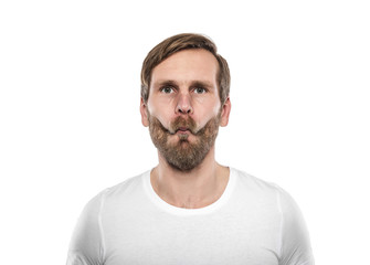 Fototapeta premium Man in white T-shirt grimaces.