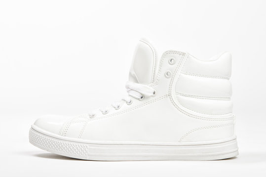 White sneakers on white background