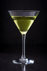 Green apple cocktail on black background
