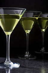 Green apple cocktail on black background
