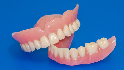 Fototapeta premium Dentures on a blue background