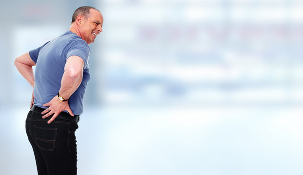  Senior man with a back pain.