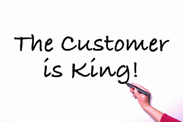 Woman writing on white board the customer is king