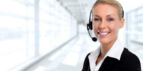 Smiling agent woman with headsets.