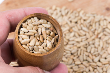 Sunflower seeds with wooden cup