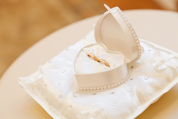 Engagement gold rings on stand for rings