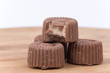 Round chocolate topped with cream