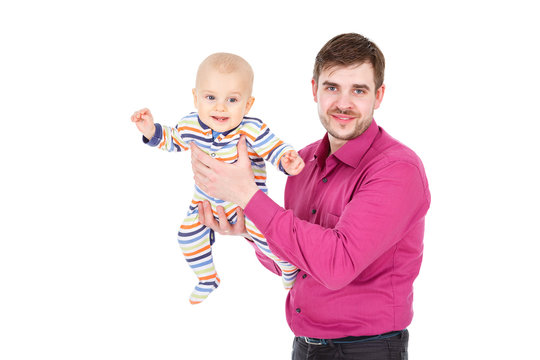 Happy Young Man Father Holding A Smiling 8-9 Months Old Baby Boy, Isolated On White