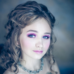Little girl with beautiful makeup. Little girl in a vintage dress. portrait of a little princess