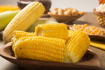 close view on Homemade golden corn cob with butter and salt on t