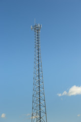 cell towers against blue sky