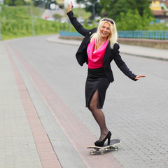 Senior business woman having fun on a skateboard outdoors. adult woman on a skateboard. business woman on a skateboard