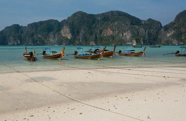 Wooden boats on sandy beach