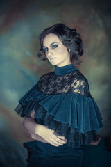 Portrait of a cute teenage girl in a vintage dress.