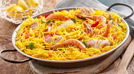 Spanish noodle and seafood specialty in pan