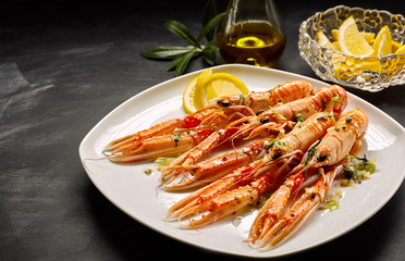 Four lobster cooked and served on plate