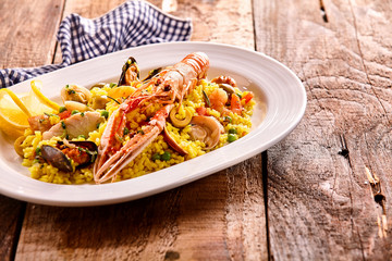 Pasta and lobster in oval plate with copy space