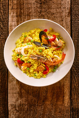Spanish Seafood Paella in White Bowl on Table