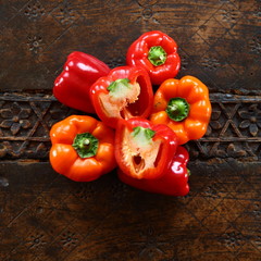 capsicum/ couple of bell peppers lying on a table