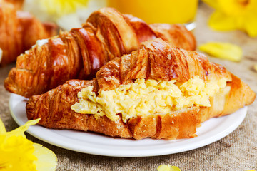 Summer Morning Breakfast Croissant stuffed scrambled eggs decorated with flowers.