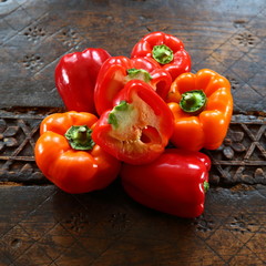 capsicum/ couple of bell peppers lying on a table