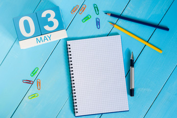 May 3rd. Image of may 3 wooden color calendar on blue background.  Spring day, empty space for text.  International or World Press Freedom Day