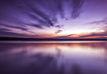 Fototapeta na wymiar Amazing symmetry lake sunset with reflection
