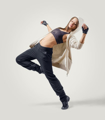 Young girl dancer leaping in Jazz Dance position