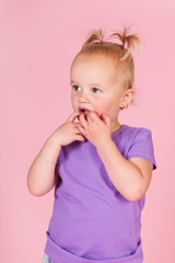 Shy toddler girl in pink