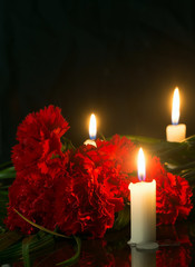 candles and red flowers