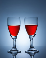 Two glasses of red wine.