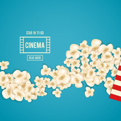 Heap popcorn for movie lies on blue background. - obrazy, fototapety, plakaty