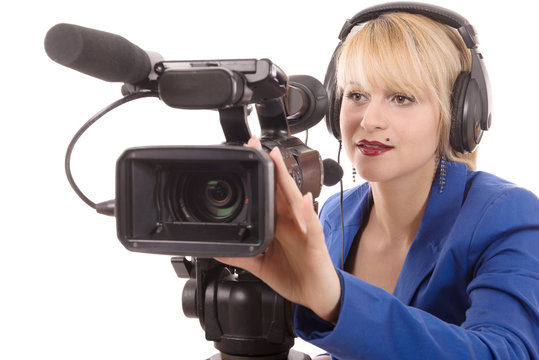 beautiful young woman with a professional video camera and headp